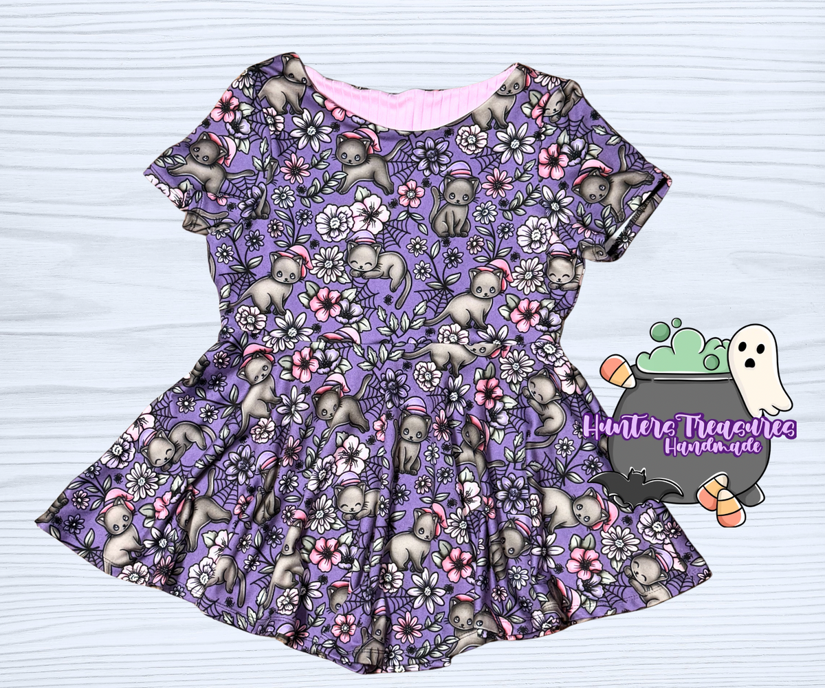 12 Briar Boatneck Peplum in Witchy Kitty